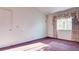 Bright bedroom featuring large window with curtains and ample closet space at 305 Crosswind Way, Las Vegas, NV 89145