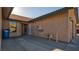Tan stucco exterior with concrete courtyard and tile roofing, creating a unique outdoor living space at 305 Crosswind Way, Las Vegas, NV 89145