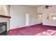 Spacious living room with a fireplace and an opening to the kitchen area at 305 Crosswind Way, Las Vegas, NV 89145