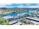 An aerial shot presents a vibrant community with a lake, shops, and ample parking, offering convenience and leisure at 3109 Siena Cir, Las Vegas, NV 89128