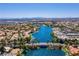 A stunning aerial view highlights the beautiful community built around a shimmering lake, showcasing its picturesque location at 3109 Siena Cir, Las Vegas, NV 89128