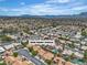 Aerial view of a residential neighborhood with mountain views and homes with private pools at 3109 Siena Cir, Las Vegas, NV 89128