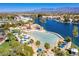 Expansive resort-style aerial view of lake with beach and a clubhouse at 3109 Siena Cir, Las Vegas, NV 89128