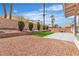 Spacious backyard featuring low-maintenance landscaping and comfortable seating area at 3109 Siena Cir, Las Vegas, NV 89128