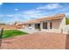Backyard with a beautiful patio and artificial turf providing a great space for relaxation and entertainment at 3109 Siena Cir, Las Vegas, NV 89128