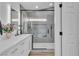 This bathroom has a granite countertop, cabinets, and a shower with a glass door at 3109 Siena Cir, Las Vegas, NV 89128