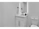 This bathroom has a vanity, sink, mirror, and toilet with tile flooring at 3109 Siena Cir, Las Vegas, NV 89128
