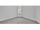 This bedroom has neutral walls, carpet flooring, baseboards, and a window at 3109 Siena Cir, Las Vegas, NV 89128