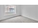 This bedroom has neutral walls, carpet flooring, baseboards, and a window at 3109 Siena Cir, Las Vegas, NV 89128