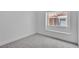 This bedroom has neutral walls, carpet flooring, baseboards, and a window at 3109 Siena Cir, Las Vegas, NV 89128
