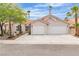 Charming single-story home with a well-maintained lawn, mature trees, and a two-car garage at 3109 Siena Cir, Las Vegas, NV 89128