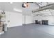 Spacious garage with epoxy floors, ample lighting and an abundance of space for storage or vehicles at 3109 Siena Cir, Las Vegas, NV 89128