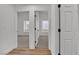 Hallway with views into two carpeted rooms, both with windows at 3109 Siena Cir, Las Vegas, NV 89128