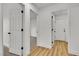 Hallway with views into carpeted and luxury vinyl plank floored rooms at 3109 Siena Cir, Las Vegas, NV 89128