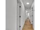 Hallway with multiple rooms and closet doors and luxury vinyl plank flooring at 3109 Siena Cir, Las Vegas, NV 89128