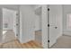 Hallway featuring views into other rooms, carpet and updated lighting at 3109 Siena Cir, Las Vegas, NV 89128