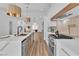 Bright, open kitchen with a marble island, stainless steel appliances, and modern lighting at 3109 Siena Cir, Las Vegas, NV 89128