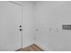 Clean, white laundry room with door, hookups, and neutral tones, ready for appliances and easy access at 3109 Siena Cir, Las Vegas, NV 89128