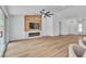 Spacious living area featuring modern lighting, fireplace, TV, and an open layout at 3109 Siena Cir, Las Vegas, NV 89128