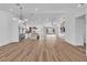 Bright, open living space featuring hardwood floors, modern kitchen, and seamless indoor-outdoor living at 3109 Siena Cir, Las Vegas, NV 89128
