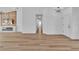 Open-concept living area features stylish lighting and beautiful flooring leading to the home's entrance at 3109 Siena Cir, Las Vegas, NV 89128