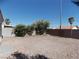 Low maintenance backyard with desert landscaping, surrounded by flowering shrubs and block wall at 319 Mulberry Glen Dr, North Las Vegas, NV 89031