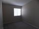 Bedroom with neutral carpet, neutral paint, and a large window at 319 Mulberry Glen Dr, North Las Vegas, NV 89031