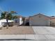 Charming single-story home featuring a low maintenance desert landscaped front yard at 319 Mulberry Glen Dr, North Las Vegas, NV 89031