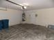Clean garage with ample space, storage, and access door at 319 Mulberry Glen Dr, North Las Vegas, NV 89031