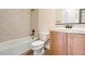 Bathroom featuring a bathtub/shower combo, toilet, and vanity at 3805 Specula Wing Dr, North Las Vegas, NV 89084