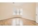 Bright bedroom with wood floors and a bay window at 3805 Specula Wing Dr, North Las Vegas, NV 89084