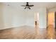 Spacious bedroom with adjoining bath and walk-in closet, wood-style tile flooring at 3805 Specula Wing Dr, North Las Vegas, NV 89084