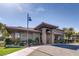 Beautifully landscaped community clubhouse with covered entrance, stone accents, and ample parking at 3805 Specula Wing Dr, North Las Vegas, NV 89084