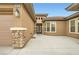 Inviting front entrance with a double door entry, stone accents, and a well-manicured landscape at 3805 Specula Wing Dr, North Las Vegas, NV 89084