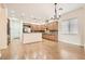 Spacious kitchen with a breakfast nook and modern lighting fixtures at 3805 Specula Wing Dr, North Las Vegas, NV 89084