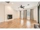 Bright living room with wood floors, fireplace, and slider to the backyard at 3805 Specula Wing Dr, North Las Vegas, NV 89084