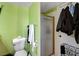 Bathroom featuring a toilet, towel rack, and glass shower doors at 3823 S Maryland Pkwy # P1, Las Vegas, NV 89119