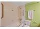 This bathroom offers a shower-tub combo with hand rails and toilet at 3823 S Maryland Pkwy # P1, Las Vegas, NV 89119