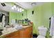 Bathroom featuring a glass bowl sink, granite counters, and ample lighting at 3823 S Maryland Pkwy # P1, Las Vegas, NV 89119