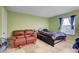 Cozy bedroom features tile flooring, soft lighting, and a comfortable seating area at 3823 S Maryland Pkwy # P1, Las Vegas, NV 89119