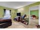 Relaxing bedroom with a bed, tile floors, and a view into another room at 3823 S Maryland Pkwy # P1, Las Vegas, NV 89119
