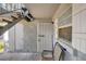 Ground floor condo entrance featuring secure front door, porch, and exterior staircase at 3823 S Maryland Pkwy # P1, Las Vegas, NV 89119