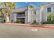 Charming two-story condo featuring a second-story balcony and manicured landscaping at 3823 S Maryland Pkwy # P1, Las Vegas, NV 89119