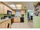 Kitchen with a combination of wood cabinets and tiled flooring at 3823 S Maryland Pkwy # P1, Las Vegas, NV 89119