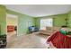 Well-lit living room with a couch and tile flooring throughout at 3823 S Maryland Pkwy # P1, Las Vegas, NV 89119