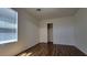 Bedroom with laminate flooring, neutral walls, and a bright window at 386 Botanic Gardens Dr, Las Vegas, NV 89148