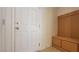 Inviting entryway with storage bench and coat hooks by the front door at 386 Botanic Gardens Dr, Las Vegas, NV 89148