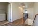 Upstairs hallway featuring wood floors, laundry area, decorative railings, and an open view at 386 Botanic Gardens Dr, Las Vegas, NV 89148