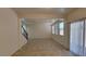 Spacious living area boasts tile floors, recessed lighting, and sliding door access to the backyard at 386 Botanic Gardens Dr, Las Vegas, NV 89148
