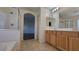 Clean bathroom with double vanity, tiled floor, and glass-enclosed shower, plus separate tub at 386 Botanic Gardens Dr, Las Vegas, NV 89148